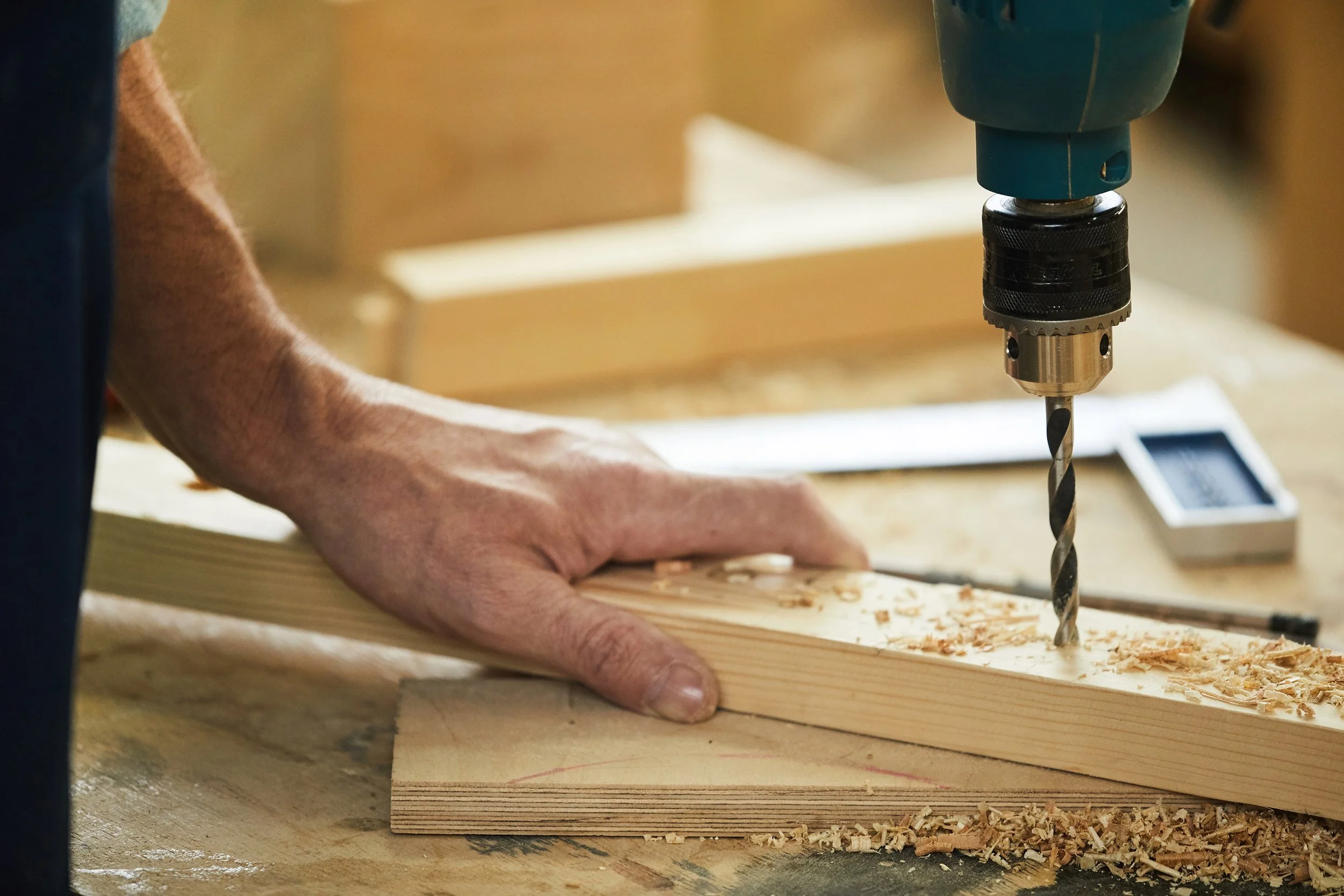 carpenter-drilling-wood-closeup-U9QNJ2S.jpg