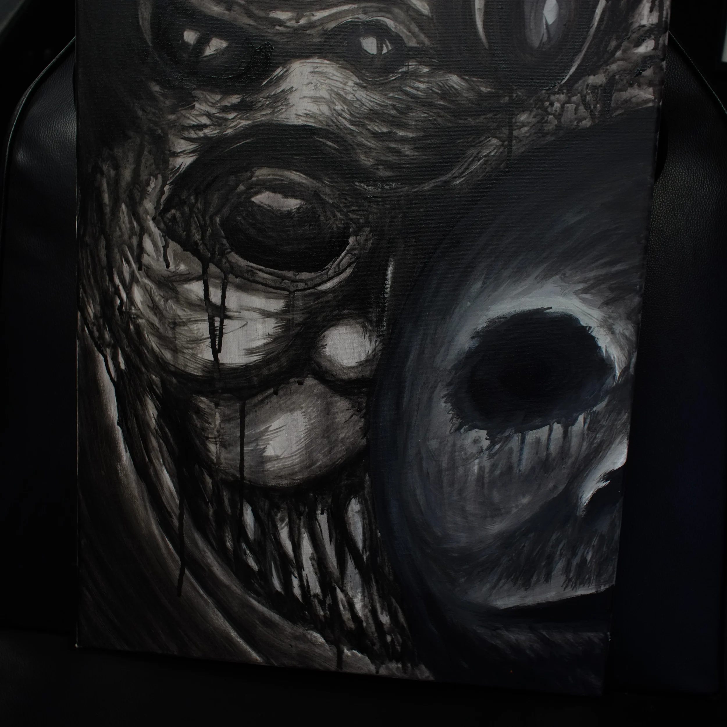 Black and white abstract painting of a face with dark eyes, dripping paint, and distorted features.