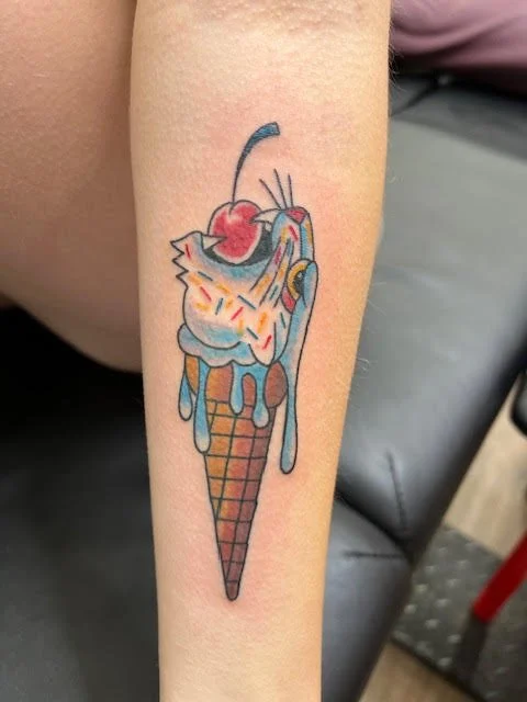 A colorful, cartoon-style ice cream cone topped with whipped cream, sprinkles, and a cherry. The playful colors and exaggerated drip effect give it a fun, illustrative charm.