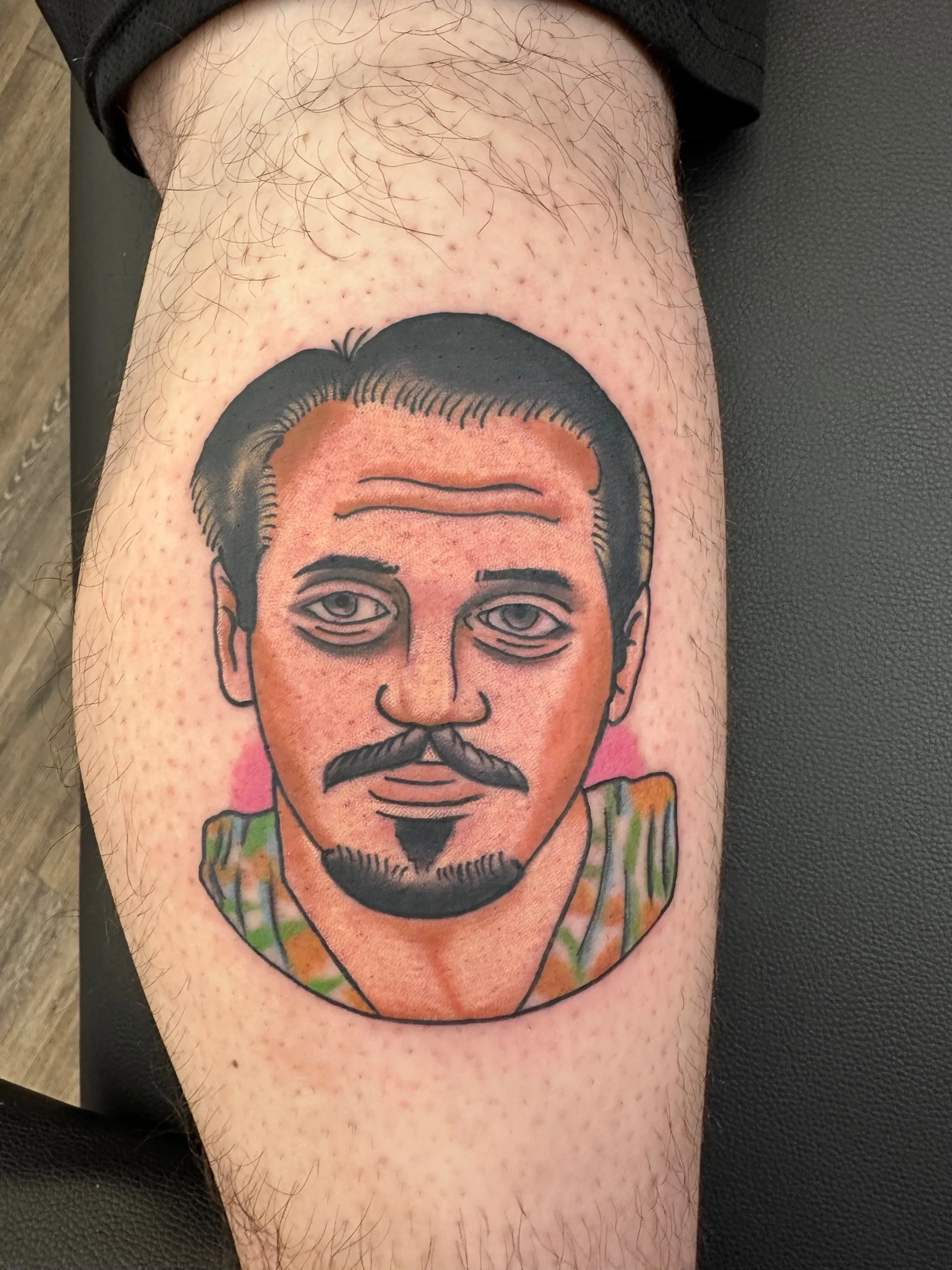 A bold, traditional-style portrait featuring crisp linework and smooth shading that gives the face a timeless, illustrative feel. The subtle color palette and fine details make it stand out as a statement piece.