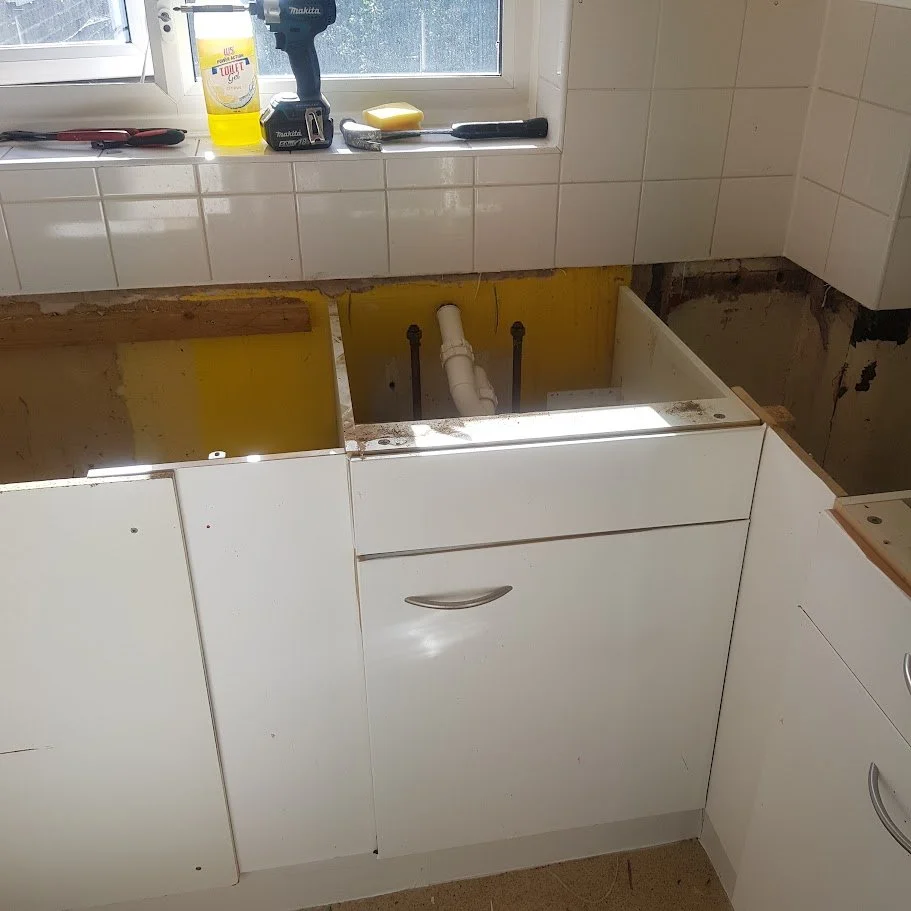 Installation of new kitchen base and wall units carried out as part of a full kitchen refurbishment, including accurate setting out, secure fixing, and alignment to housing association specifications.