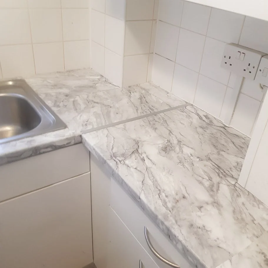 Completed kitchen installation including new worktop fitting and finishing works, delivered in line with Local Authority and housing association standards for void and occupied properties.