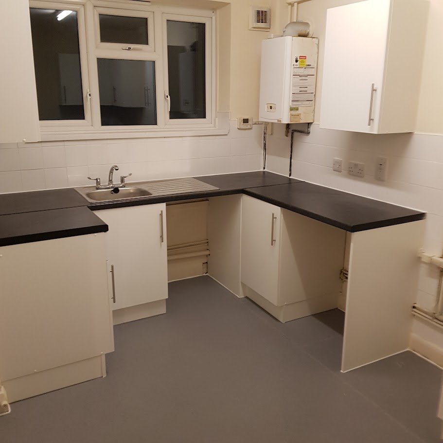 Final stage kitchen works showing new worktop installation and completed kitchen refurbishment in line with Local Authorities compliance standards.