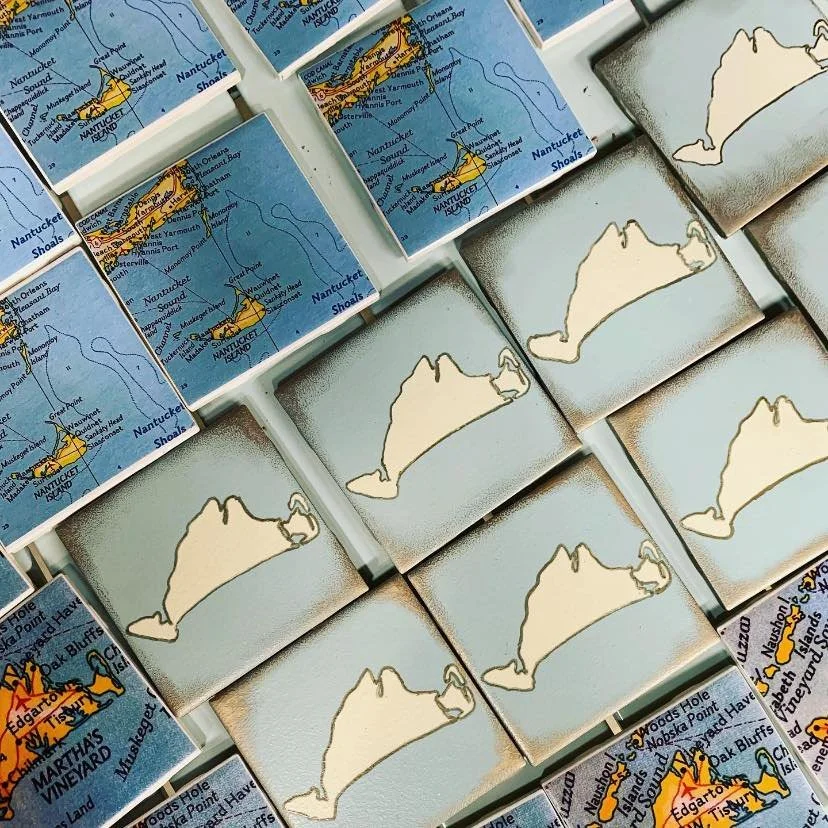 Stacked coasters with maps of Martha's Vineyard, Nantucket, and an outline of the island