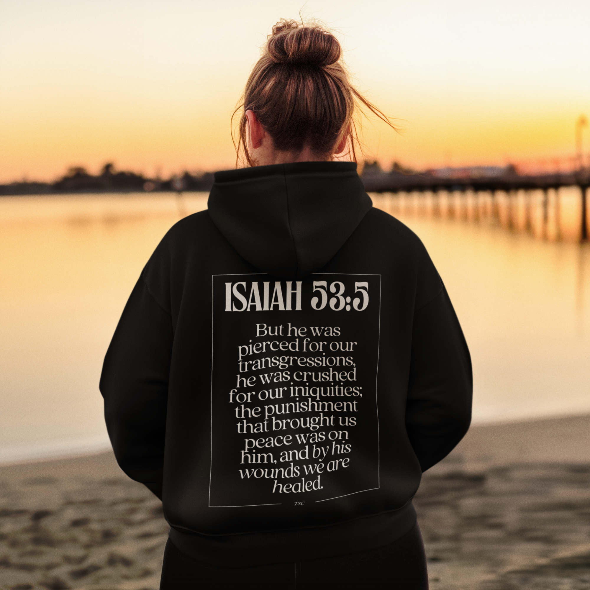 back-view-mockup-of-an-ai-created-woman-wearing-a-hoodie-at-a-lake-m52592.png