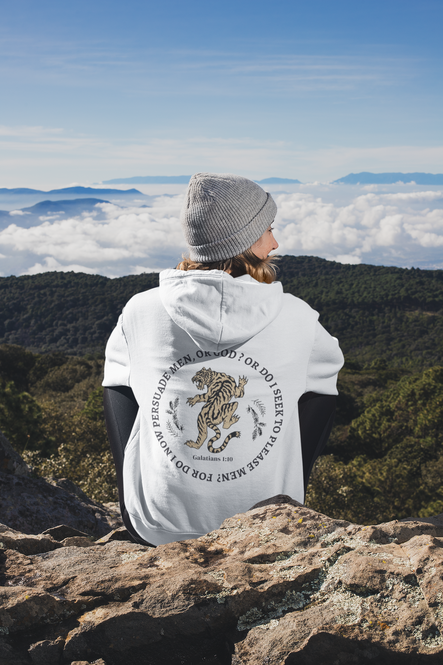 back-view-mockup-of-a-woman-wearing-a-hoodie-while-sitting-in-nature-30491.png