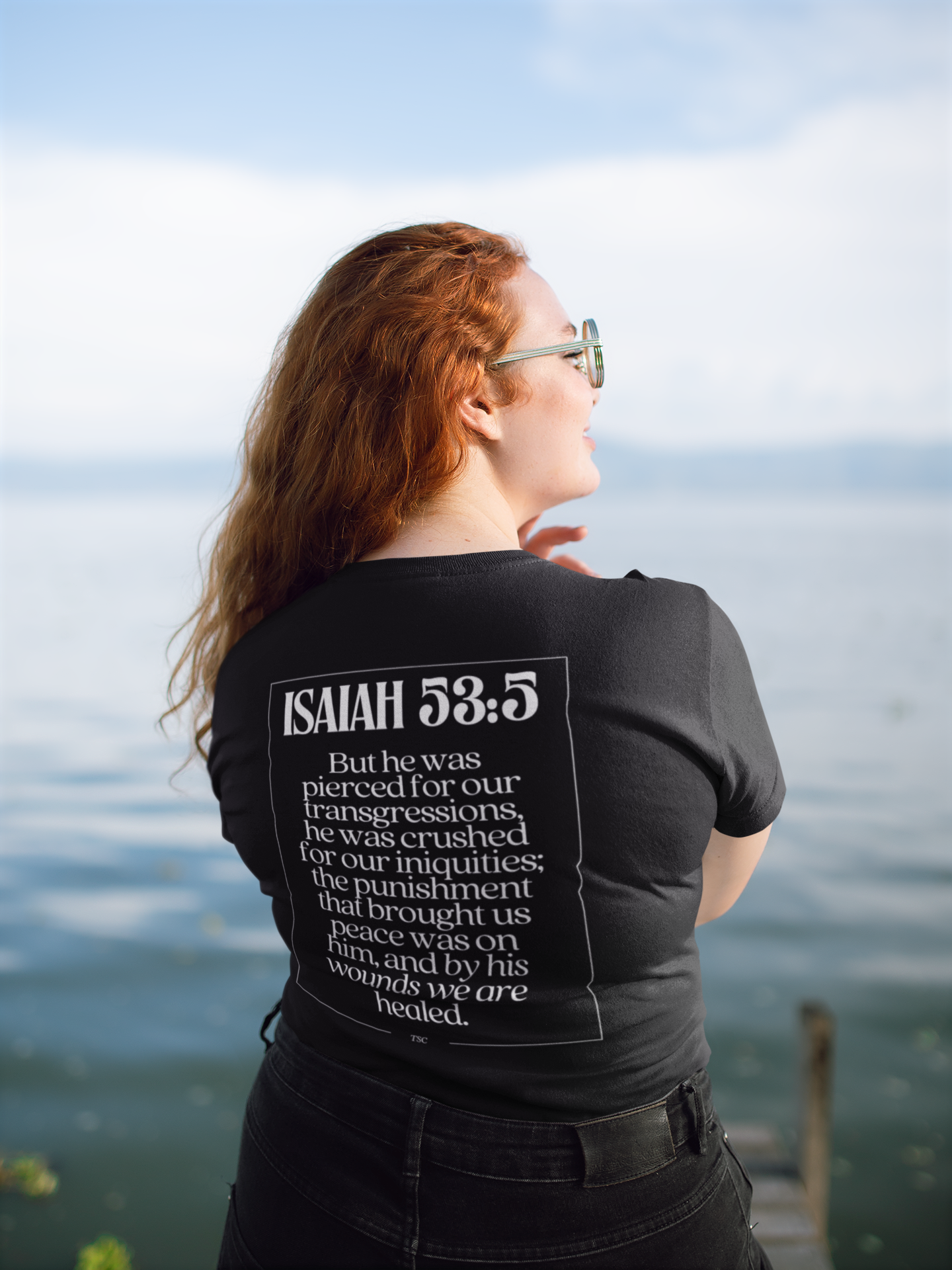 back-view-t-shirt-mockup-of-a-red-haired-woman-facing-a-lake-21938-2.png