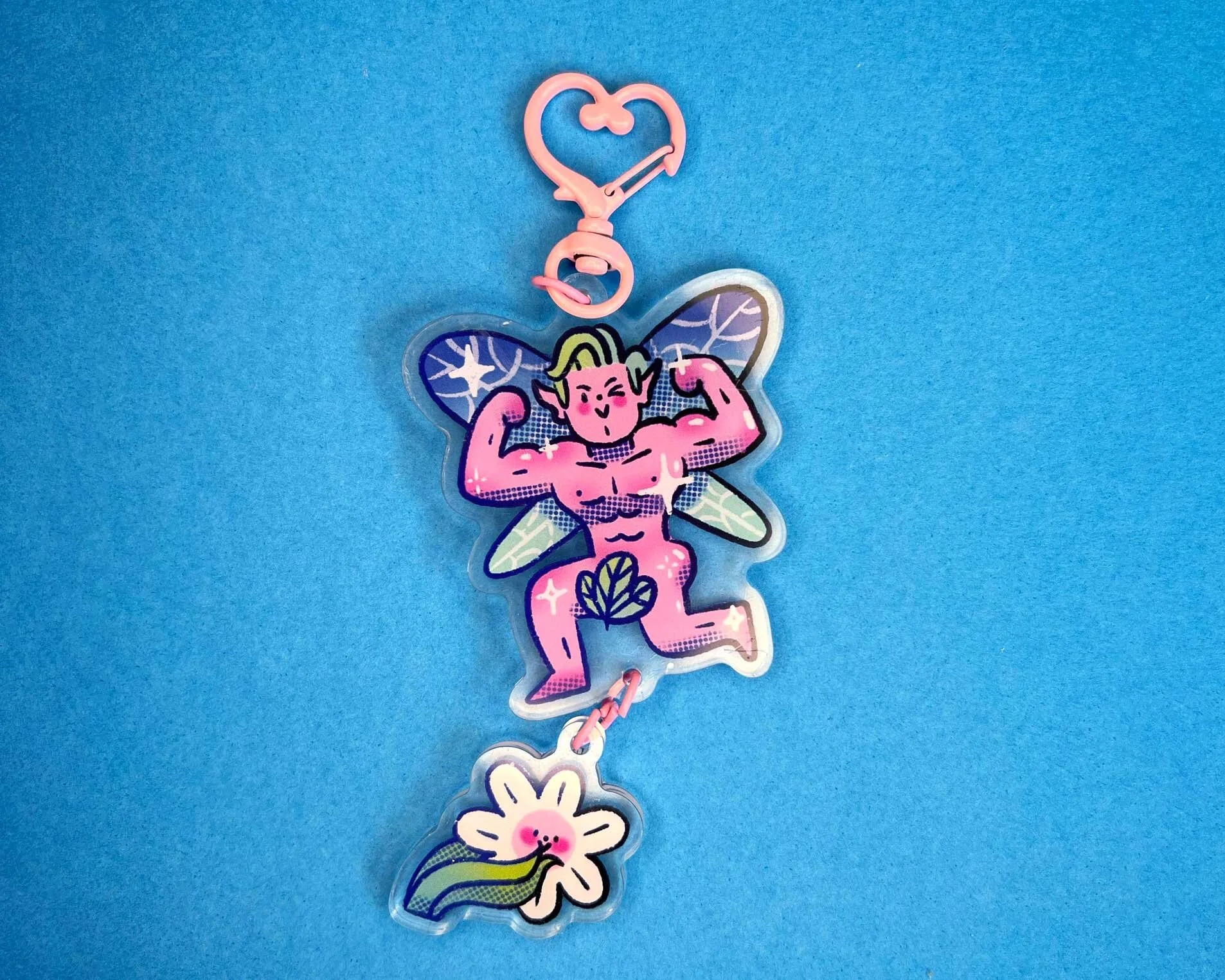 Illustrated sexy pink fairy keychain with blushing flower inspired by romantasy, ACATAR books.