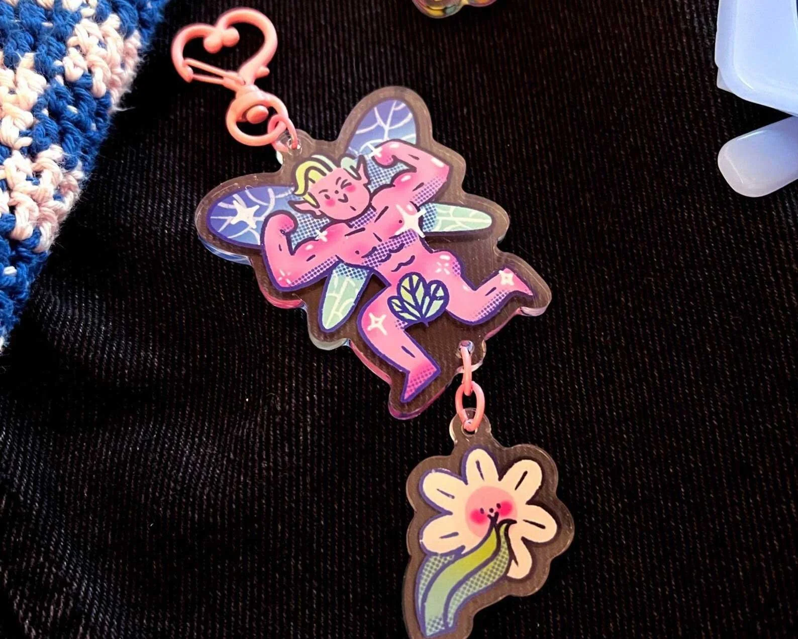 Illustrated sexy pink fairy keychain with blushing flower inspired by romantasy, ACATAR books.