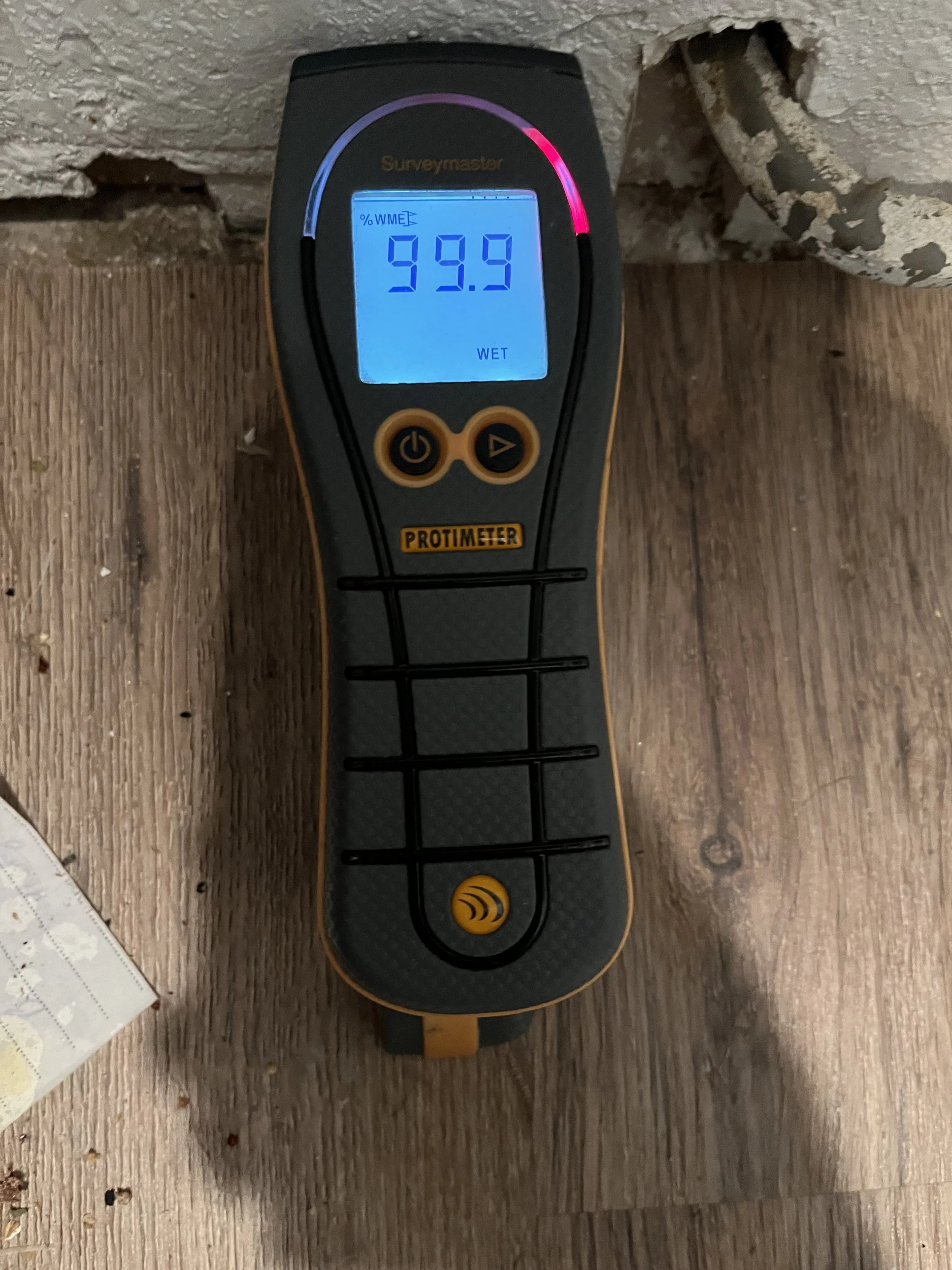 Modern house on a hillside with rolling green hills in the background