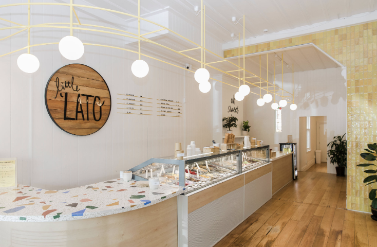 'Little Lato' Ponsonby store, showing display case with gelato and ice cream, modern decor, and warm lighting.