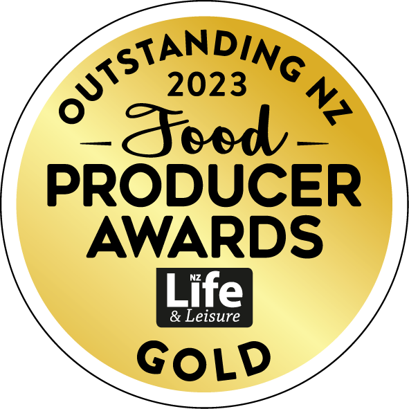Gold badge with black text and a white border displaying the 2023 NZ Food Producer Awards by NZ Life & Leisure, highlighting outstanding NZ food producers.