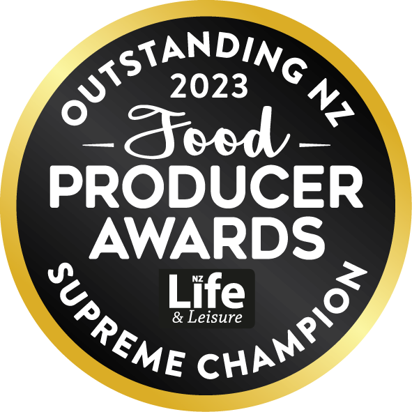 Black and gold circular badge for the 2023 Outstanding NZ Food Producer Awards, organized by NZ Life & Leisure, with words 'Supreme Champion'.