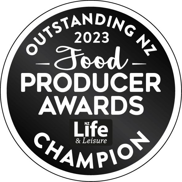 Circular badge for the 2023 Outstanding NZ Food Producer Awards, featuring text and a black and white design.