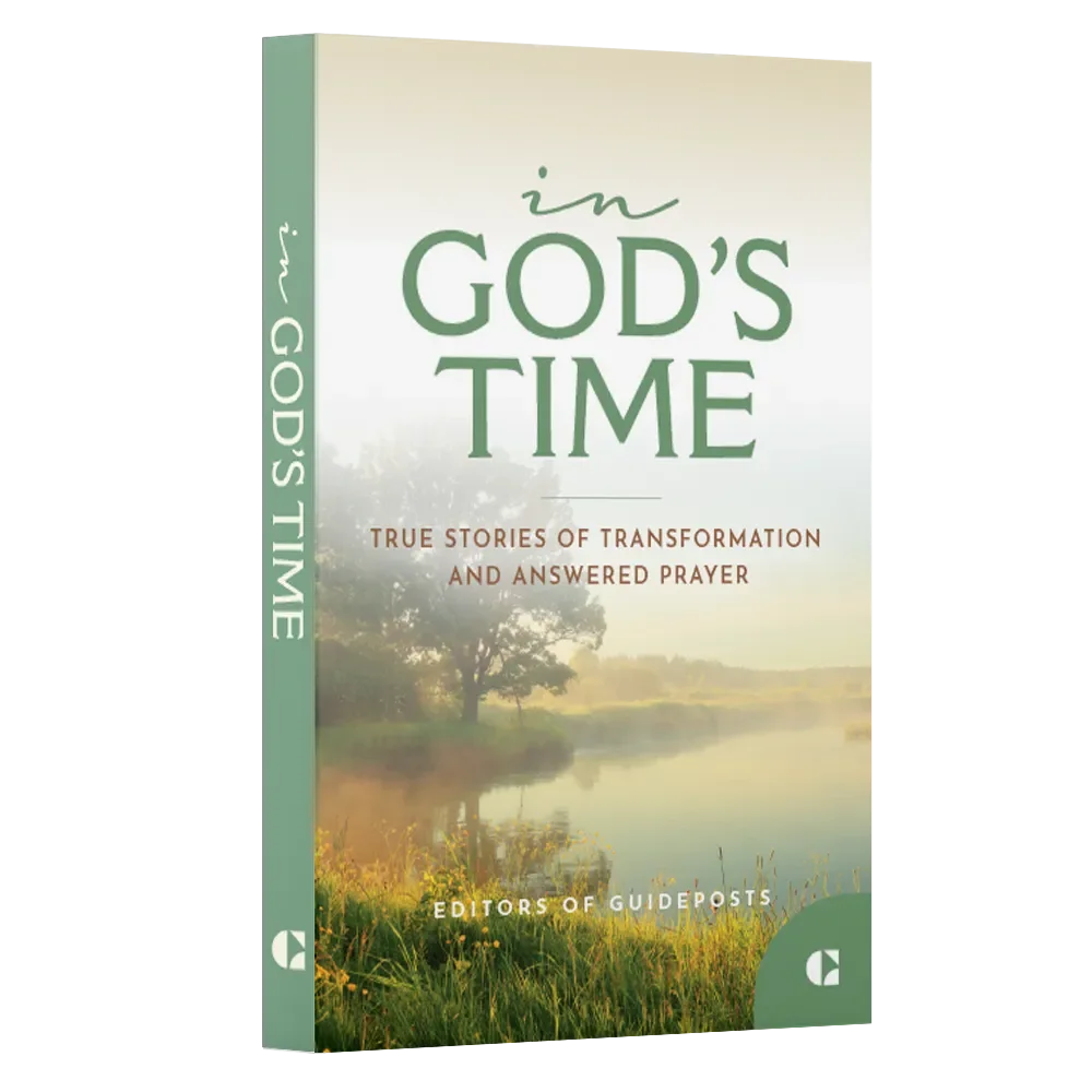 Cover of a book titled 'In God's Time' with a scenic nature background showing a river, trees, and a grassy area.