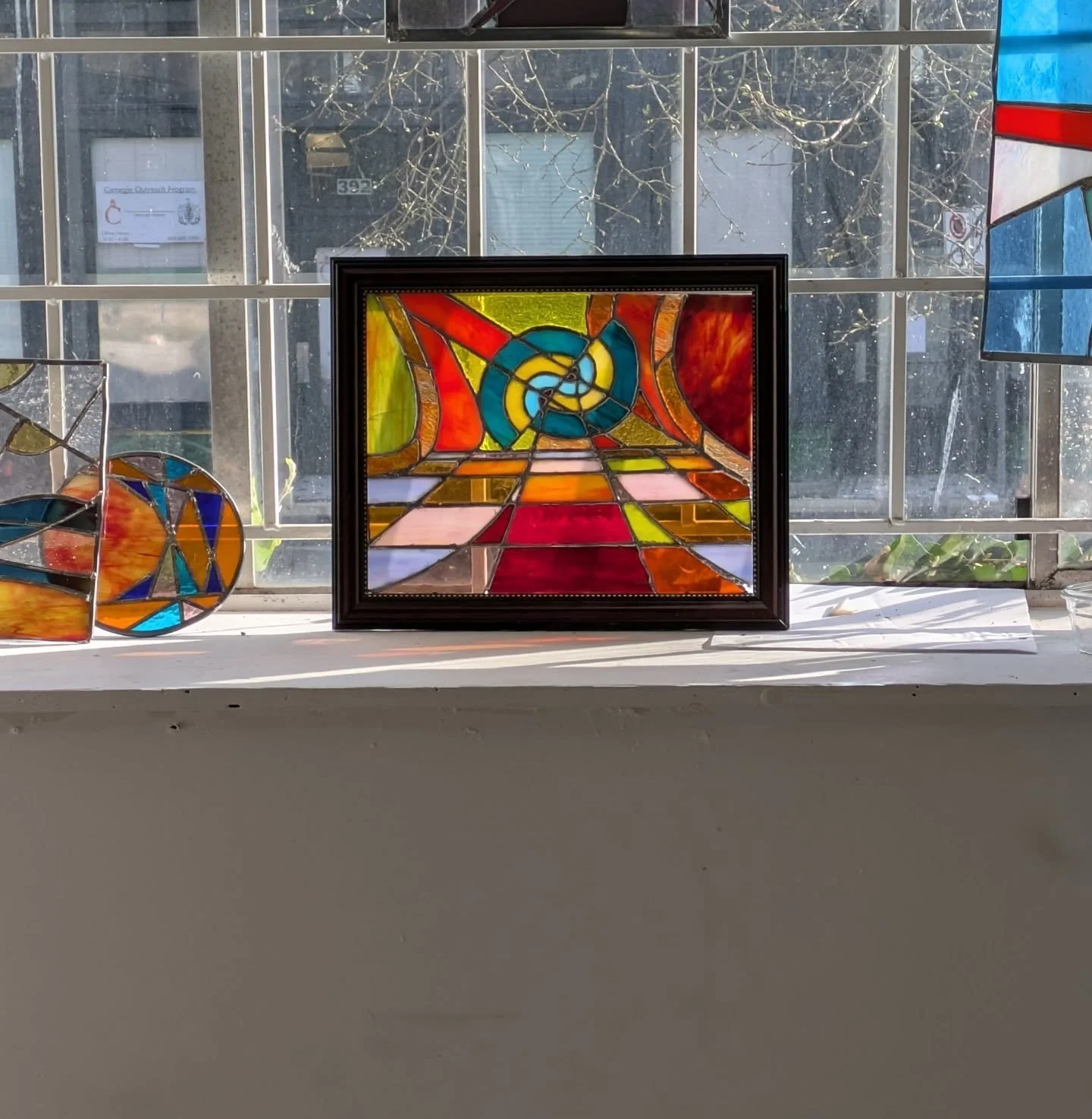 Touched up the broken ward, it broke for real and so I re-soldered it and give her a handsome frame. 

#artstudio #stainedglass