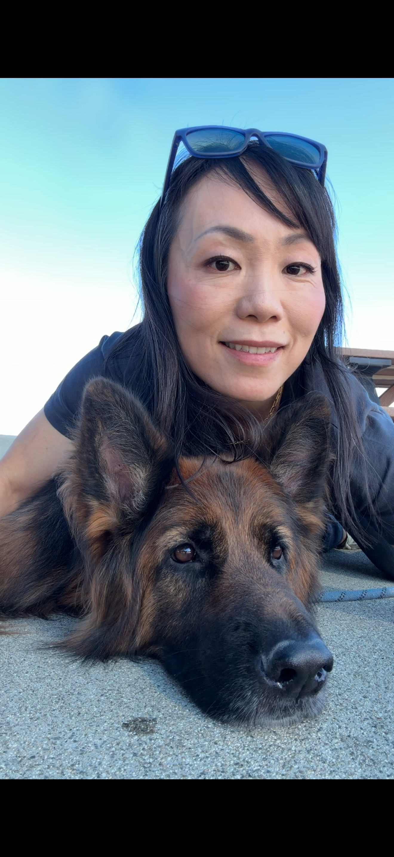 Smiling Asian woman with dog