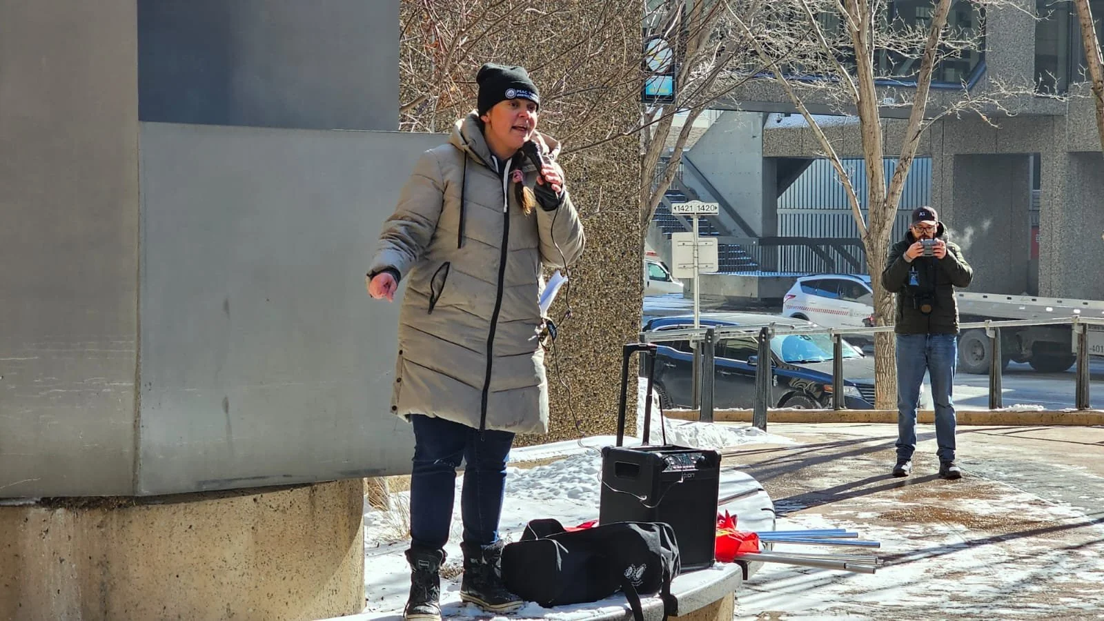 Krysty speaking to a mic