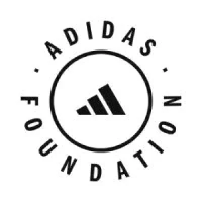 Adidas logo with three black stripes inside a circle, surrounded by the words 'Adidas' and 'Foundation' in black text.