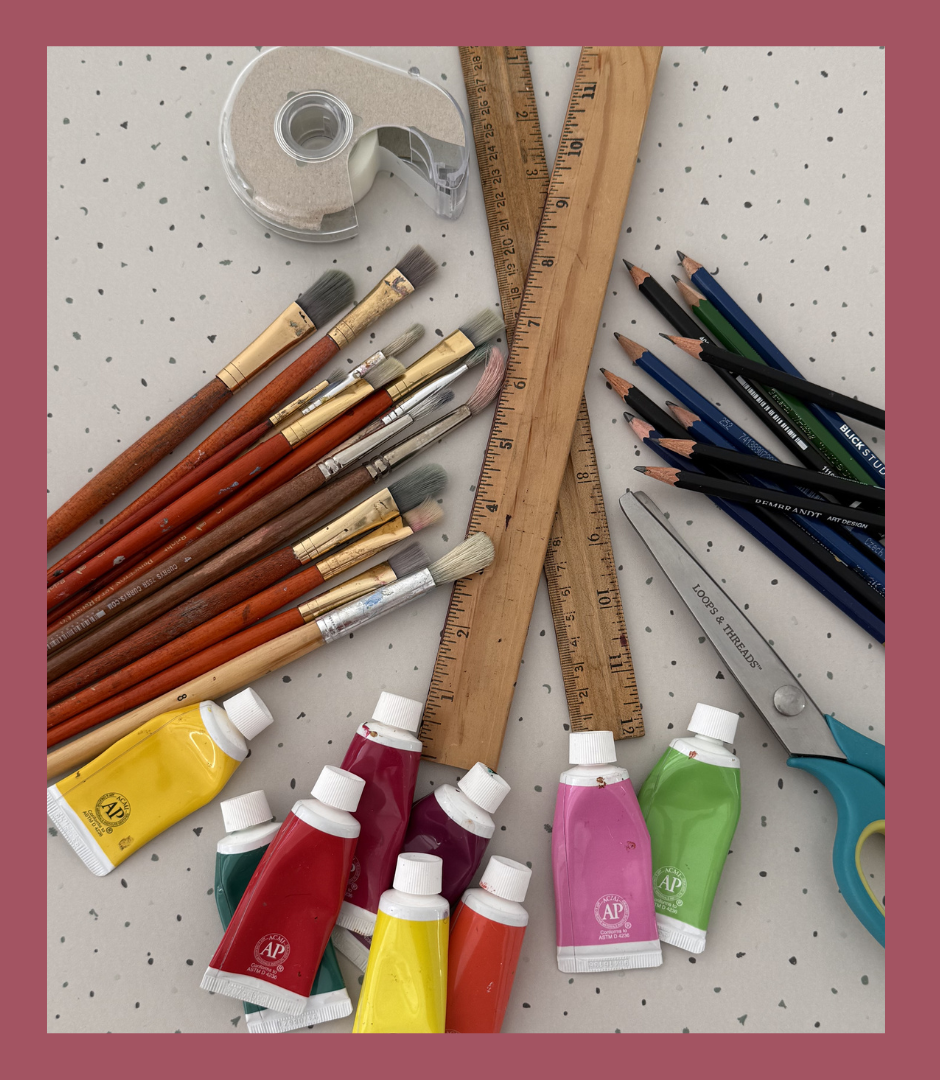 Photograph of art supplies on a table.