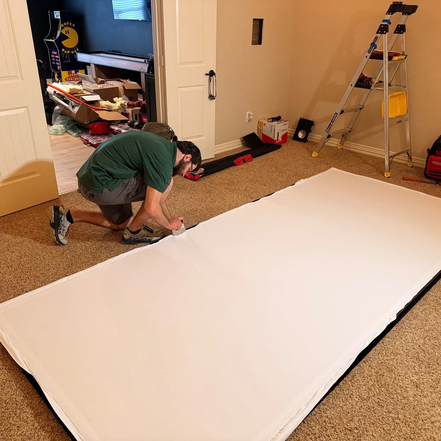 Dylan hard at work building a 141&rdquo; diagonal acoustically transparent Seymour Screen Excellence video screen.