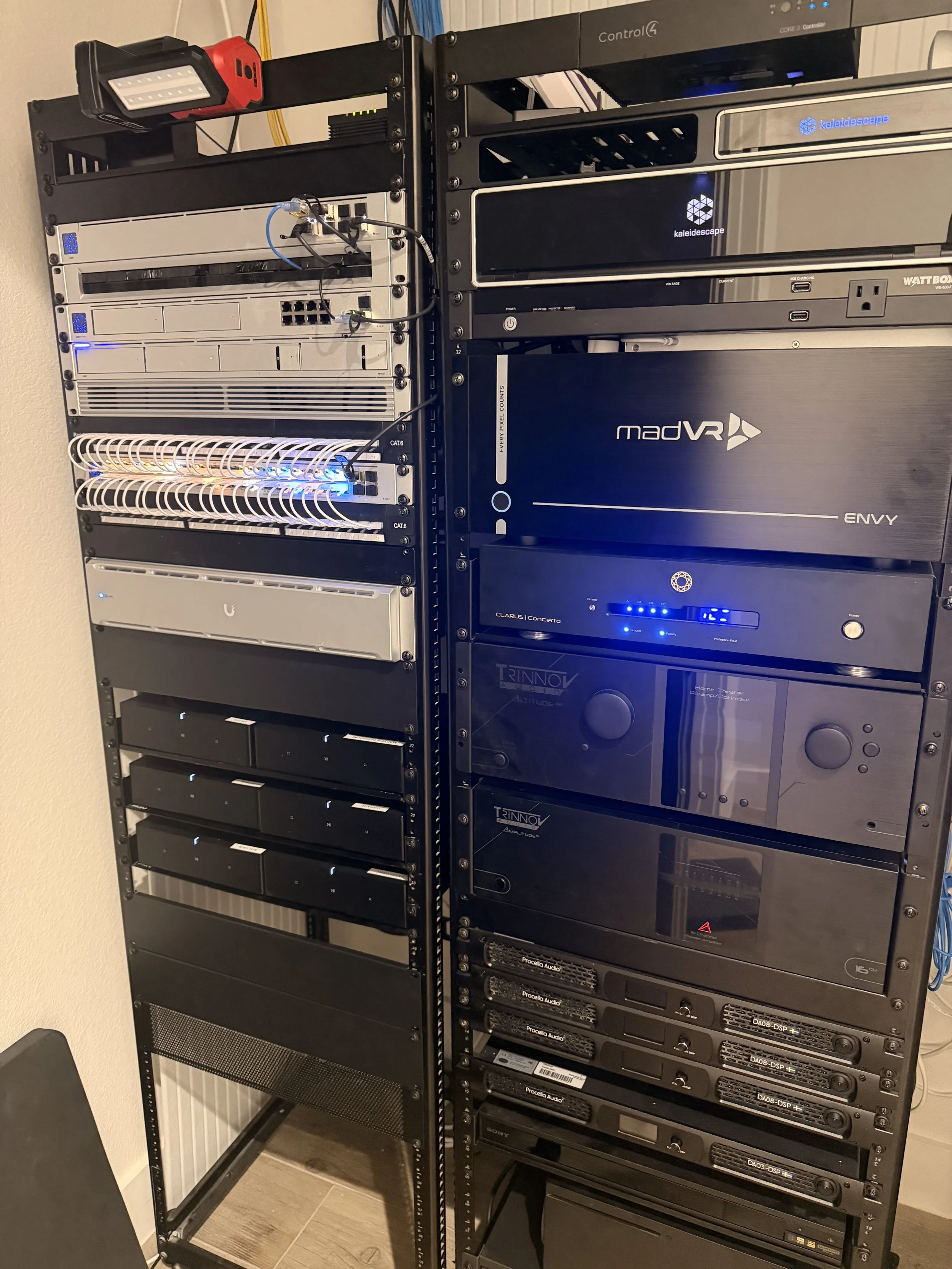 Woodlands Home Theater equipment rack, show casing Madvr Extreme MK3 video processor, Kaleidescape Strato C with 48TB Terra Prime movie server, Trinnov Altitude 32 w/Amplitude16 and Procella Audio Amplifier's.  Sonos Amps for whole home audio