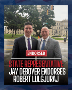 Photo of two men in suits standing outdoors with Capitol building in background, promoting Jay Deboyer's endorsement of Robert Lulgjuraj for state representative.