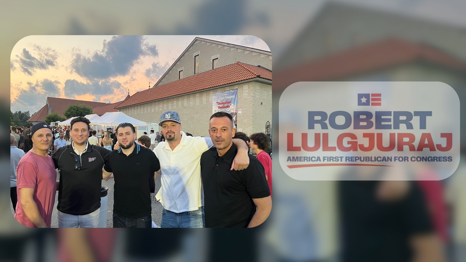 A group of five men standing together outdoors at a gathering or event, with a church building and tents in the background during the evening sky.