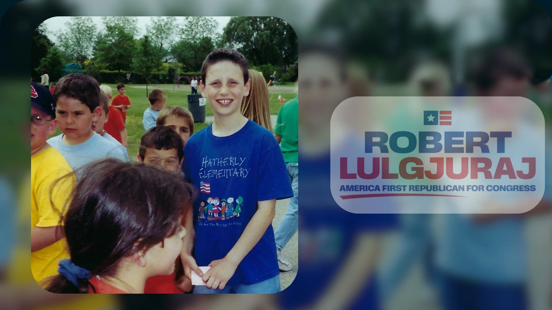 A young boy at Hatherly Elementary School wearing a blue shirt, smiling, surrounded by other children outdoors at a park or field.