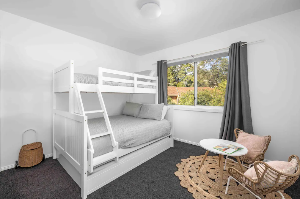 Kids room with triple trundle bed