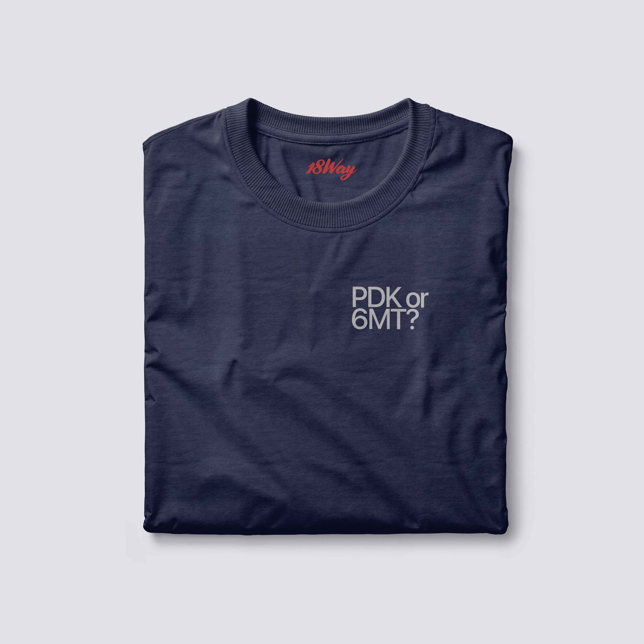 Navy blue 18Way T-shirt with red '18Way' label inside the collar and white text 'PDK or 6MT?' printed on the chest.