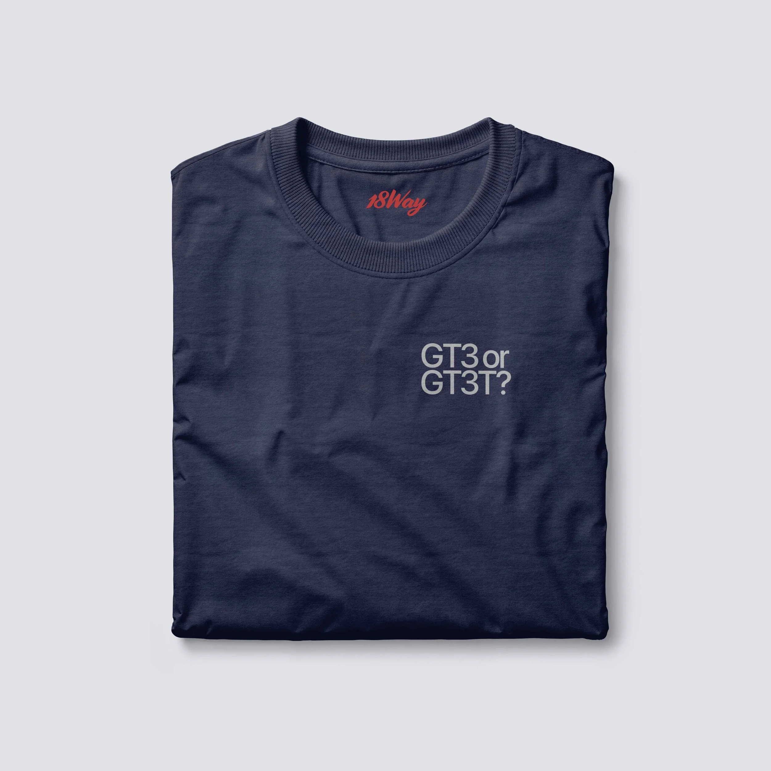 A navy blue 18Way t-shirt with the text 'GT3 or GT3T?' printed on the front in white. The t-shirt is folded and placed on a light gray background.