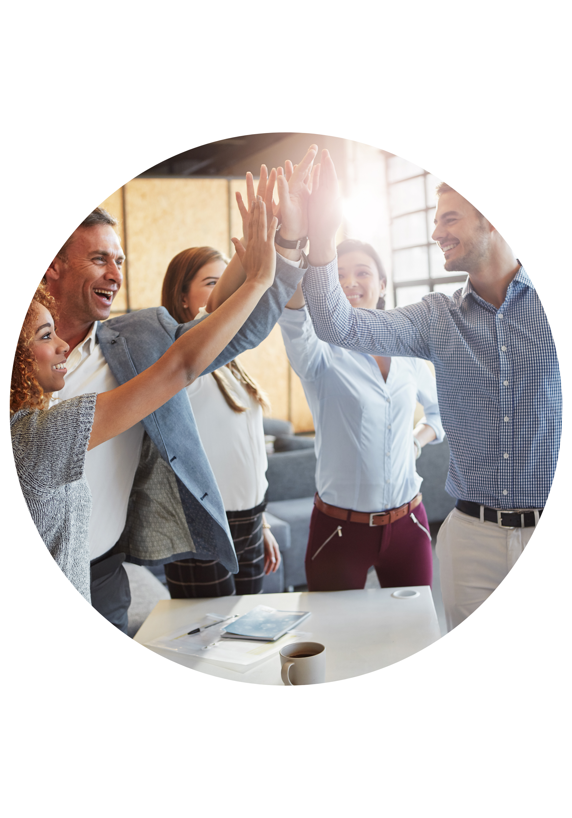 Group of diverse colleagues giving high fives in an office meeting room