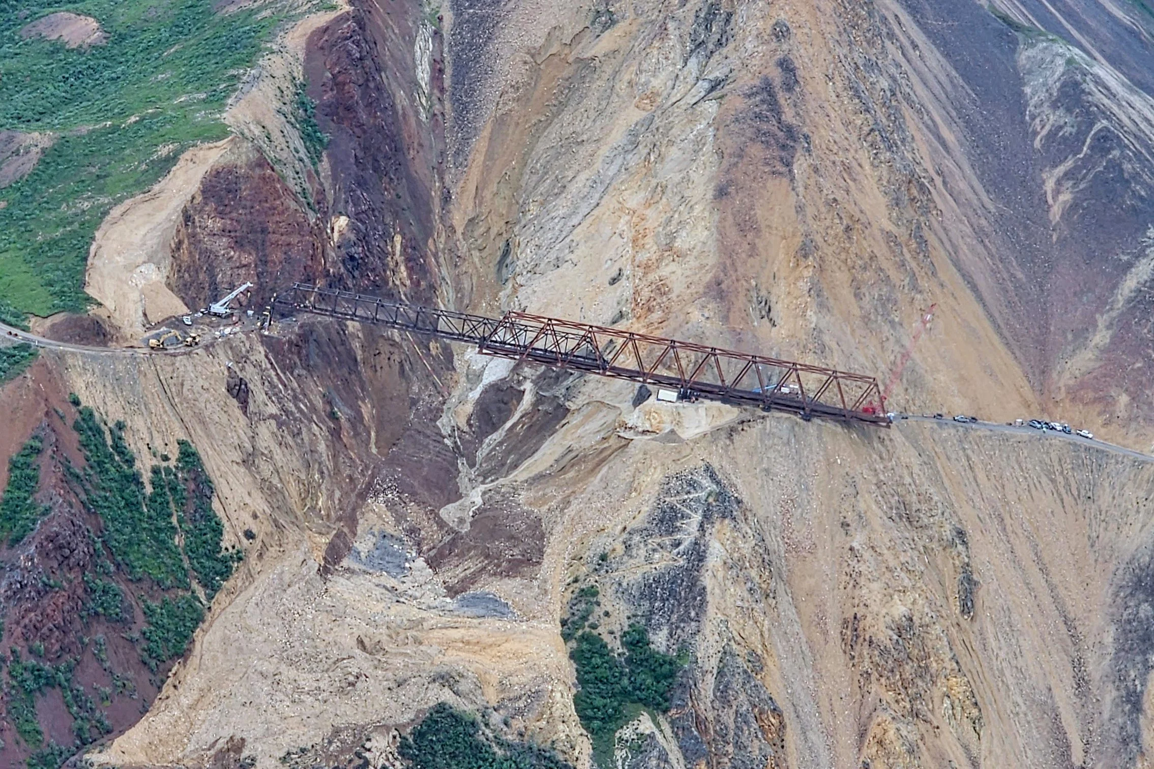 Aerial view from a small bush plane flying over the rugged mountains and river valleys of Denali National Park.