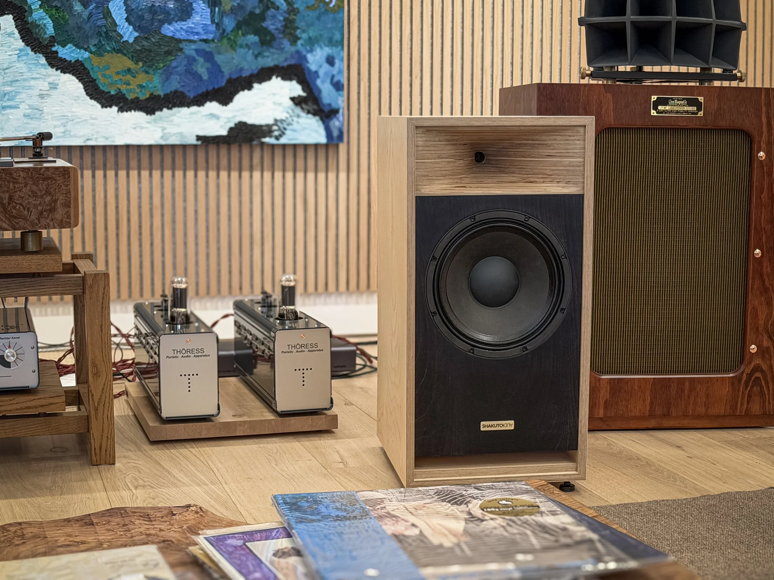High-end audiophile speakers by Shakuto Audio featuring custom wood finish and modern horn speaker design