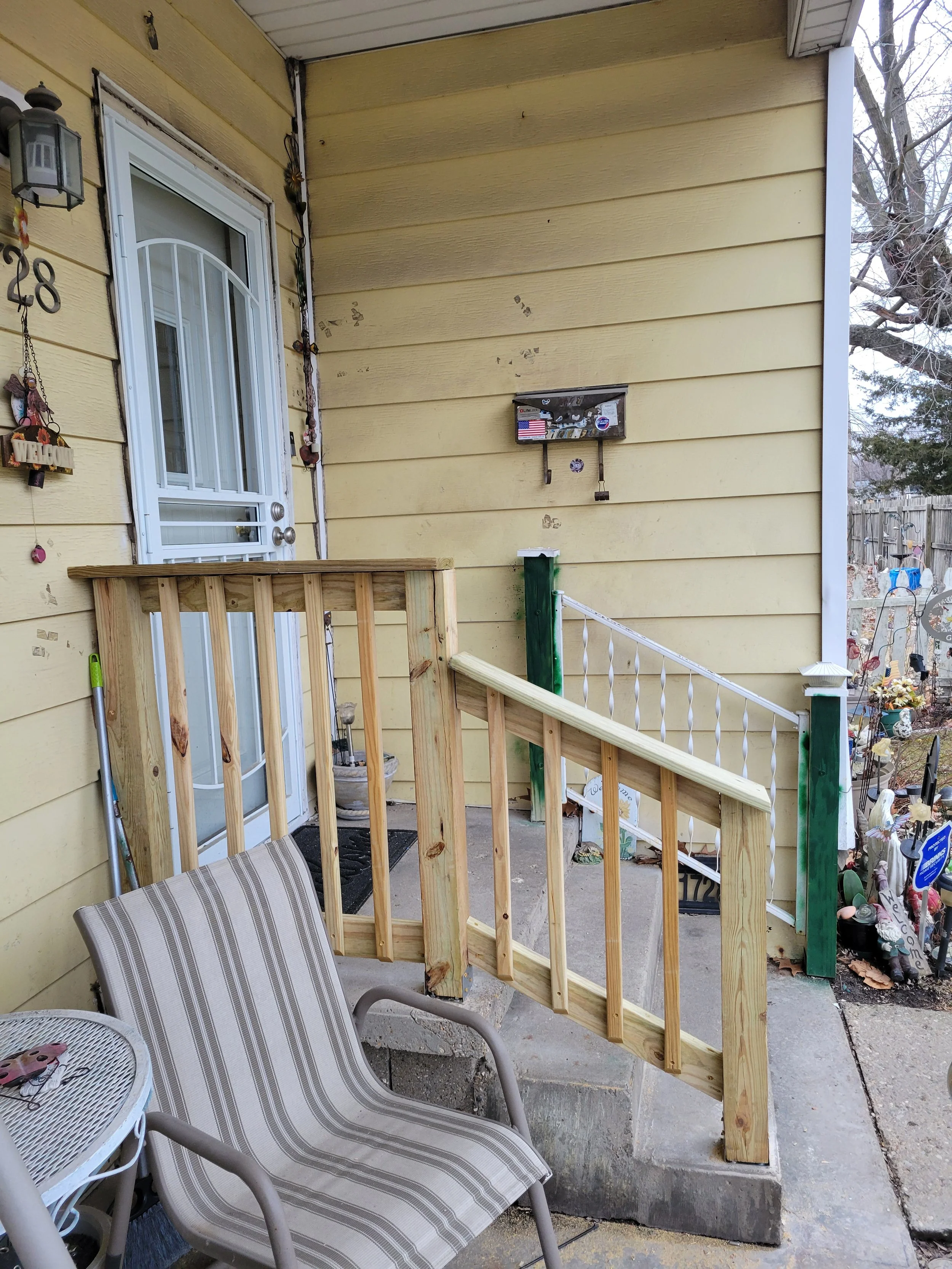 New wood porch railing and steps. Exterior carpentry. Springfield, IL