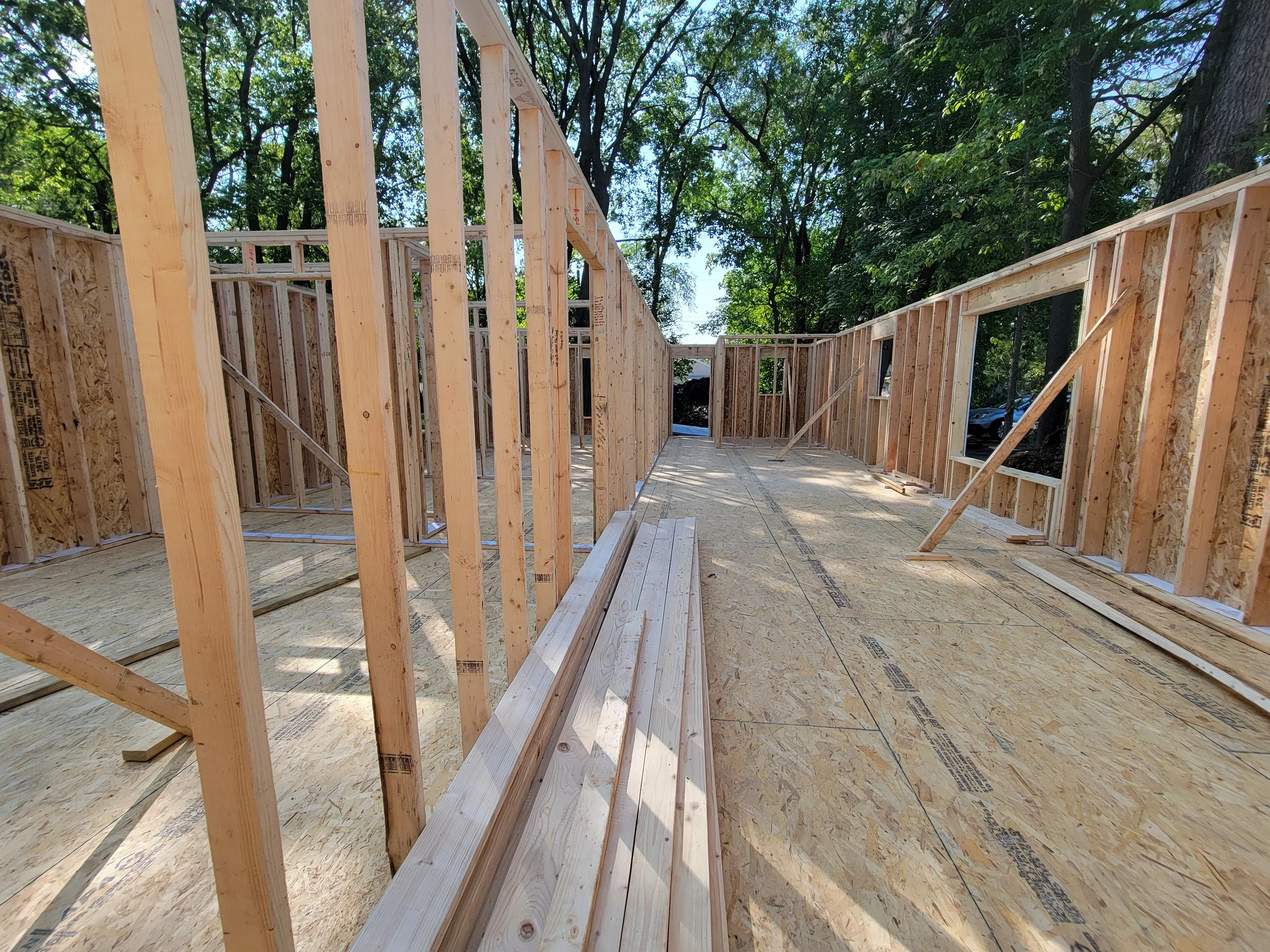 Wall framing and subfloor, same post-frame building as the aerial photo. Springfield, IL
