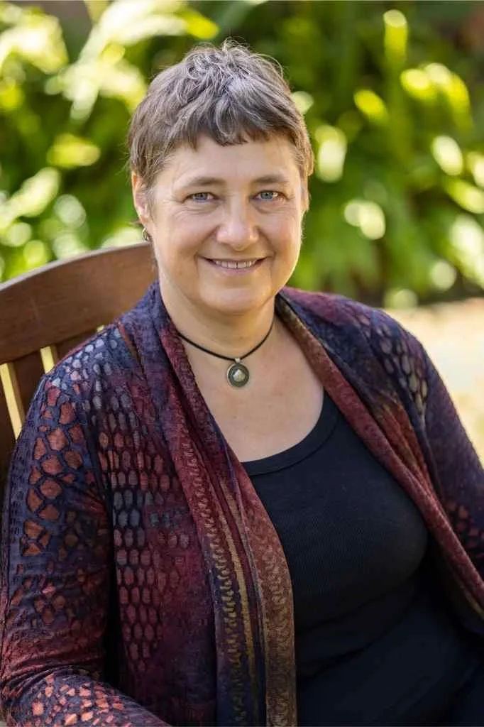 Photo of Amanda Mortimer, Ph.D., sitting in a chair