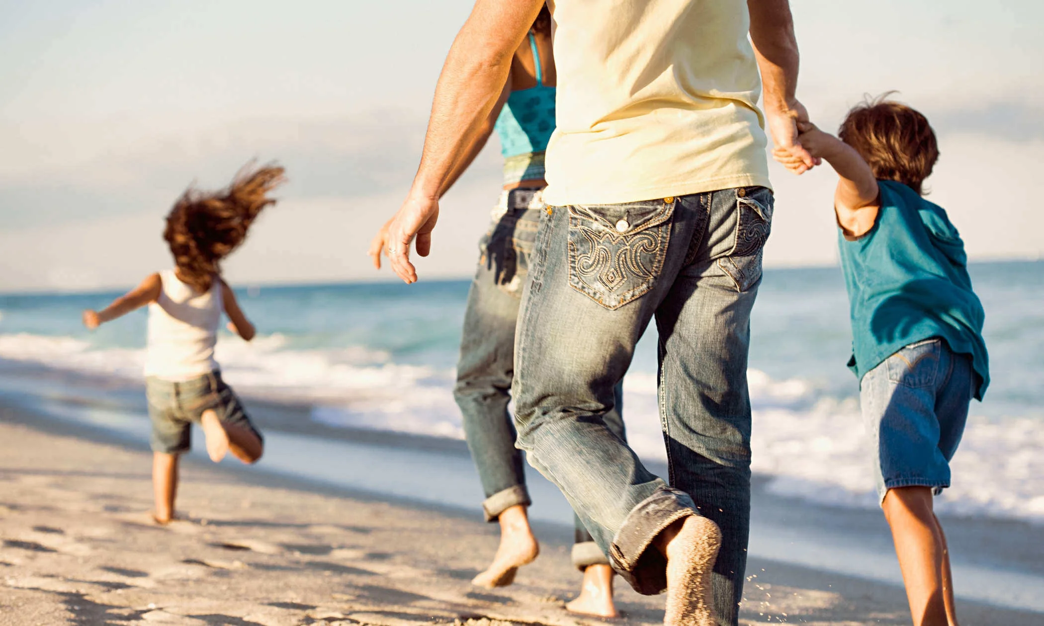 Family-running-on-beach.jpg