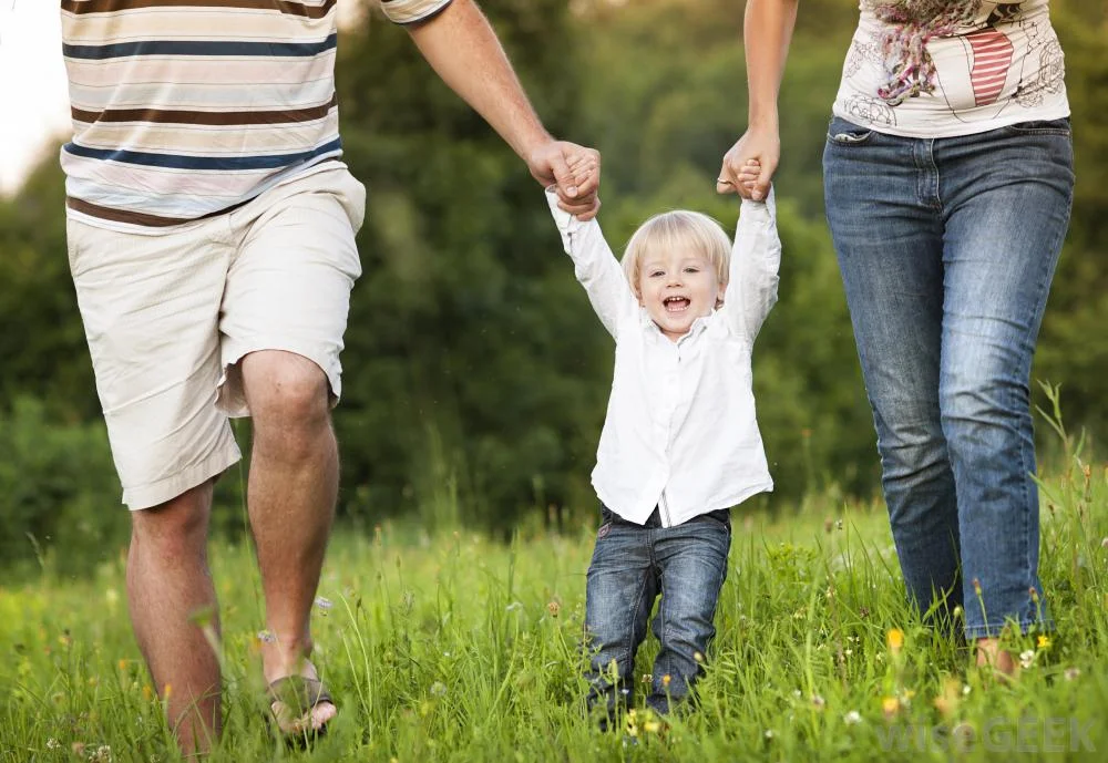 child-holding-parents-hands.jpg