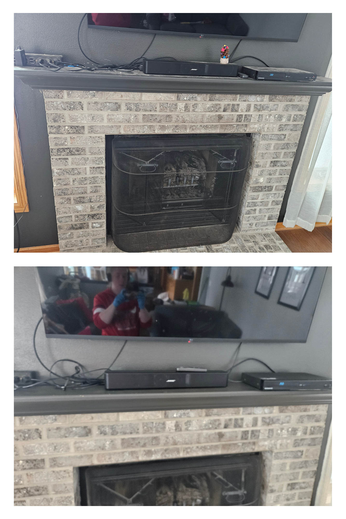 Living room fireplace with a mounted TV and sound system on the mantel. The TV is turned off, and there are various electronic devices and cables on the mantel. A reflection of a person taking the photo is visible in the TV screen.