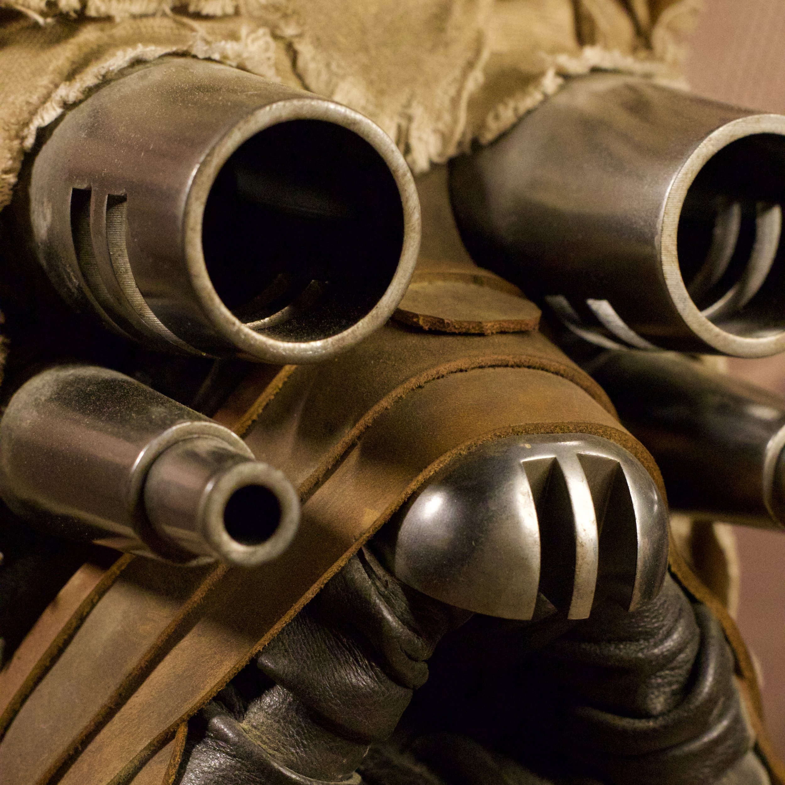 Close-up of aluminum pipes and other accents on a helmet with slots.