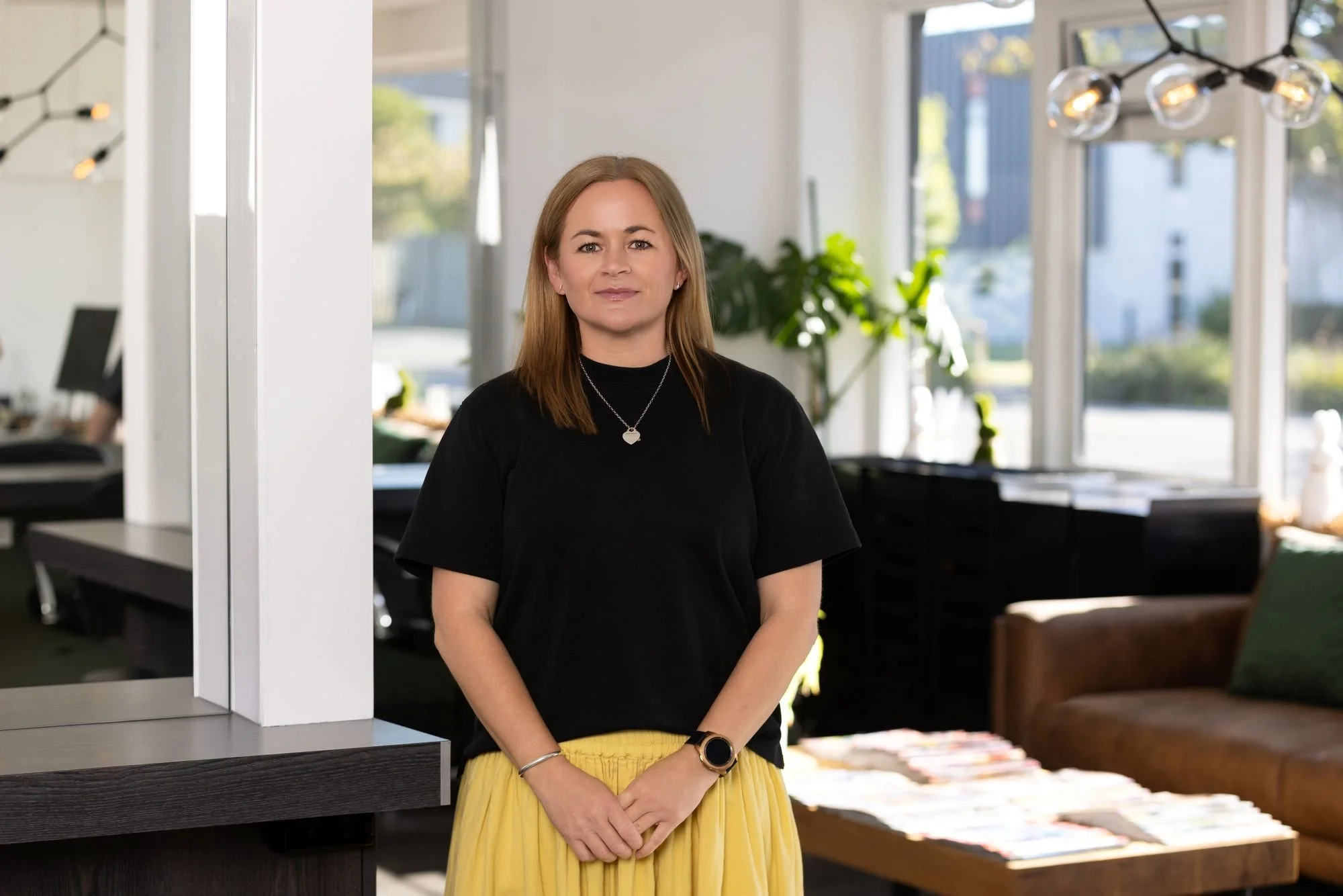 Picture of Kim Philpott, Master Stylist, smiling in the salon