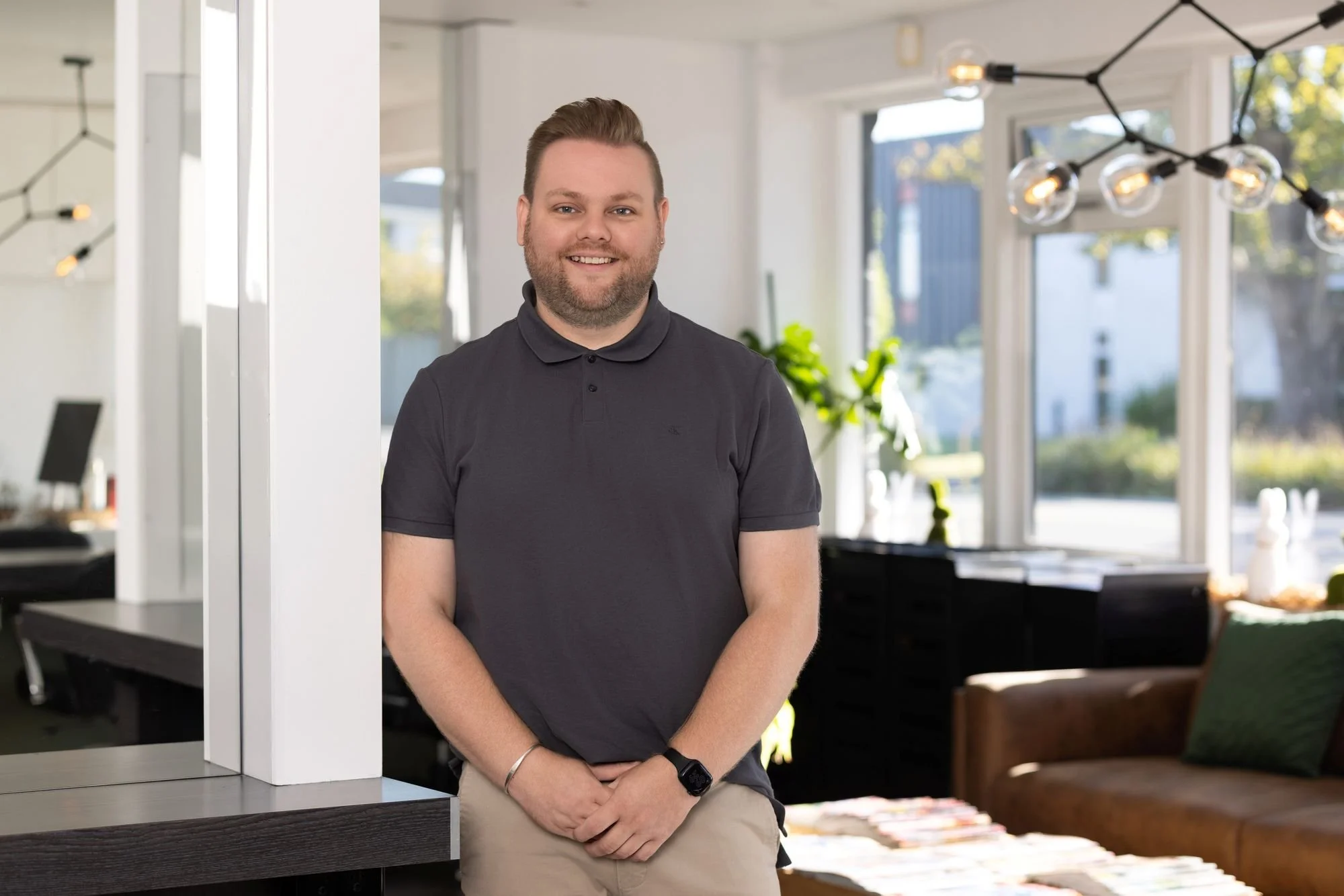 Picture of Cameron Aitken-Boyle, Salon Director, smiling in the salon