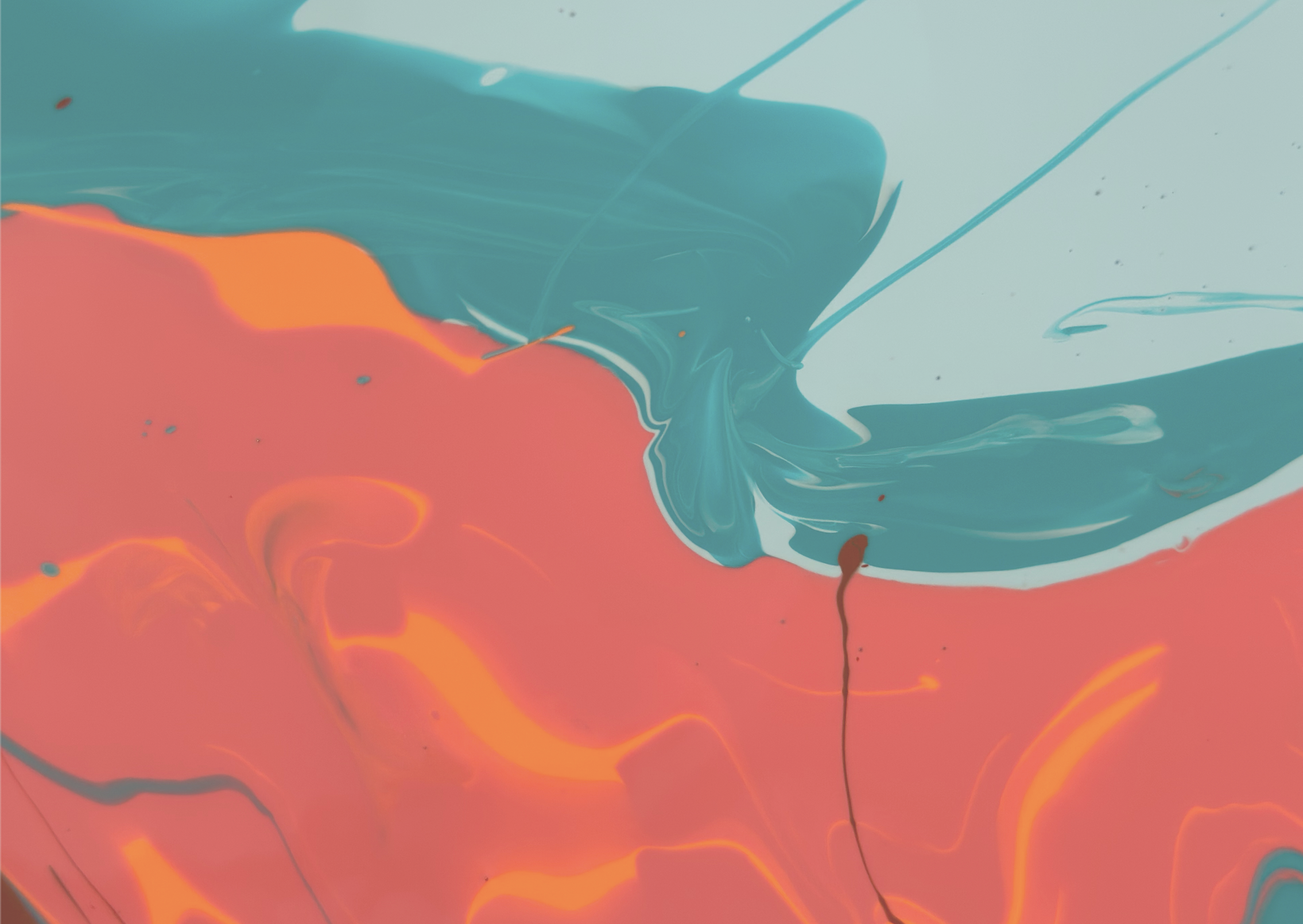 Abstract swirl of blue, orange, and teal paint mixing on a surface.