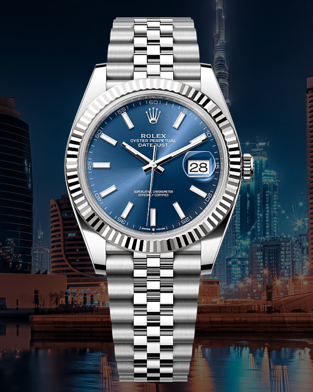A silver Rolex Oyster Perpetual Datejust wristwatch with a blue dial, set against a cityscape at night featuring skyscrapers and reflections on water.