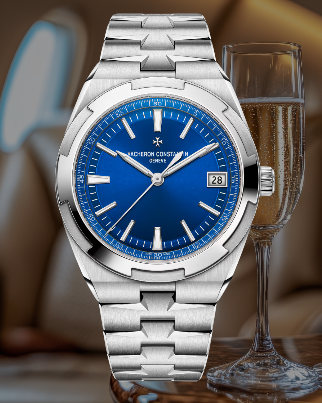 A luxury Vacheron Constantin wristwatch with a blue dial, silver hour markers, and a silver bracelet, positioned in front of a champagne glass filled with bubbly, on a wooden surface.