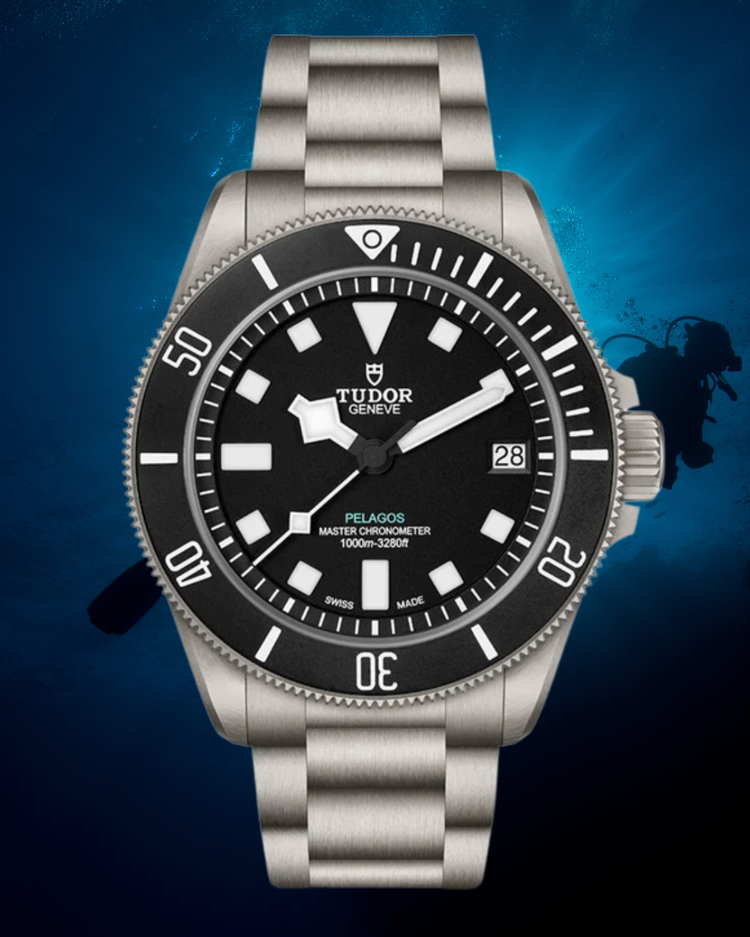 A Tudor Pelagos dive watch with a stainless steel band, black dial, and a rotating black bezel, shown against an underwater background with a diver silhouette.