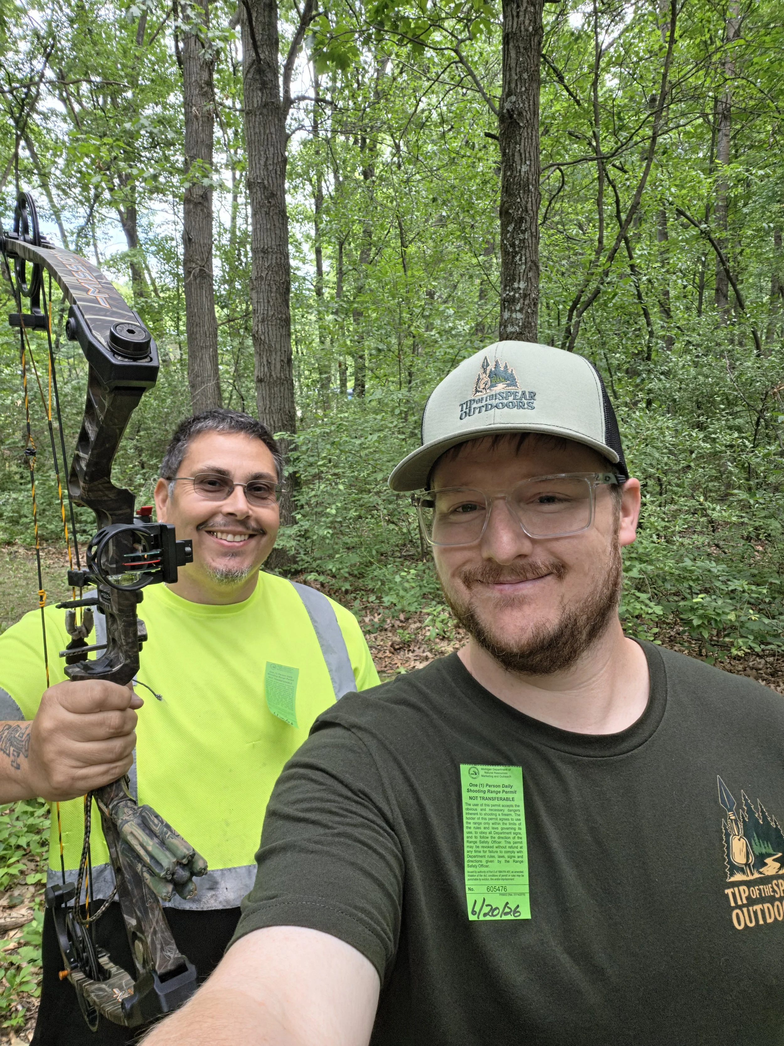 Michigan hunting guide with hunter during pre-season archery coaching and hunt preparation.