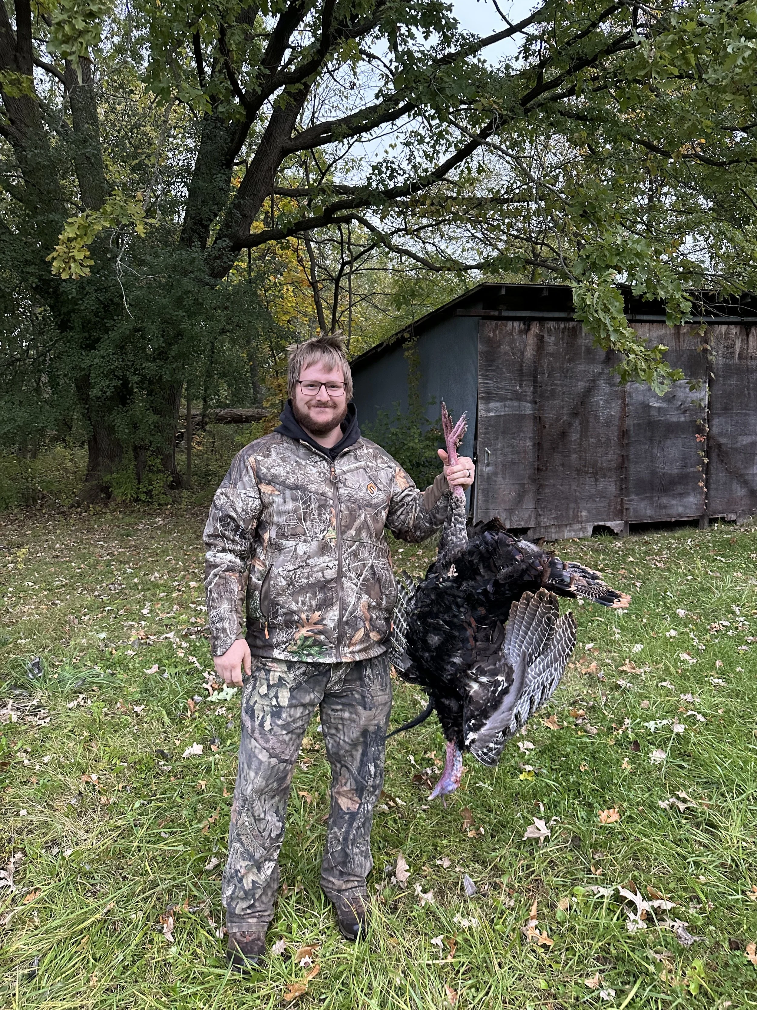 Ethical Michigan wild turkey harvest demonstrating responsible hunting and field experience.